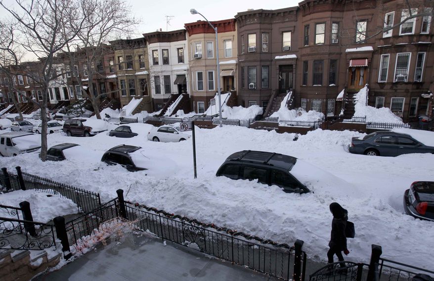 While most residents had cleared sidewalks of snow, many streets remained unplowed in the Sunset Park section of New York's Brooklyn borough on Tuesday, Dec. 28, 2010. (AP Photo/Seth Wenig)
