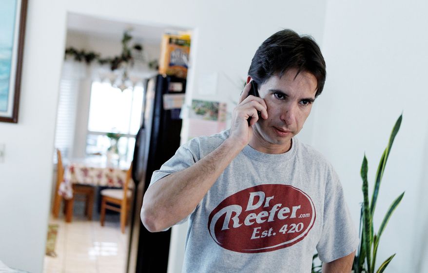 Pierre Werner answers a phone call Dec. 9 at his mother's home in Las Vegas concerning his business license, which was revoked. Mr. Werner's medical marijuana referral business was shut down by authorities. (Associated Press)