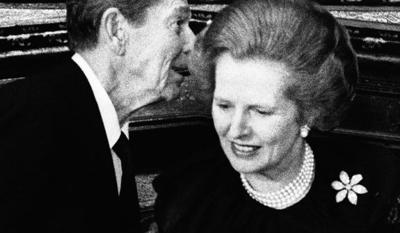 ** FILE ** President Ronald Reagan has a word in the ear of British Prime Minister Margaret Thatcher at a reception given by the British government at London&#39;s St. James&#39;s Palace for leaders attending an economic conference in 1984. (AP Photo, File)