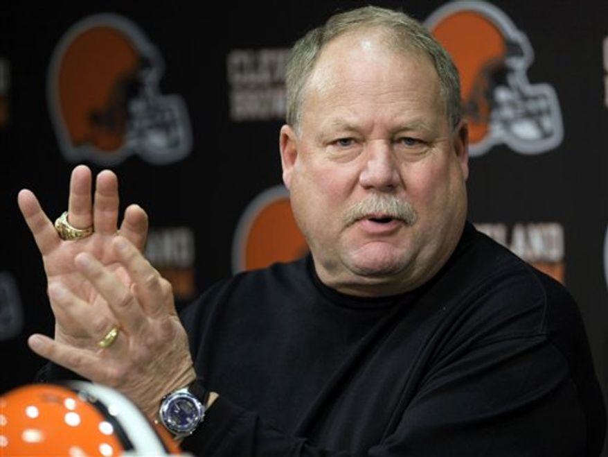 FILE - In a Jan. 12, 2010 file photo,Cleveland Browns president Mike Holmgren answers questions during a news conference announcing Tom Heckert Jr. as the Browns general manager, in Berea, Ohio. Holmgren will decide in the coming days whether to keep coach Eric Mangini for a third season. Holmgren, who took Green Bay and Seattle to the Super Bowl, has left open the possibility of coaching again. (AP Photo/Tony Dejak, File)