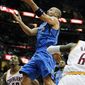 Cleveland Cavaliers&#x27; Alonzo Gee, right, grabs a rebound against Dallas Mavericks&#x27; Brendan Haywood in the first quarter during an NBA basketball game Sunday Jan. 2, 2011, in Cleveland. (AP Photo/Ron Schwane)