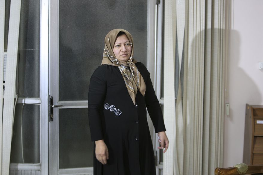 ** FILE ** Iranian Sakineh Mohammadi Ashtiani, who has been sentenced to death by stoning for adultery, arrives for a news briefing in the northwestern Iranian city of Tabriz on Saturday, Jan. 1, 2011. (AP Photo/Vahid Salemi)