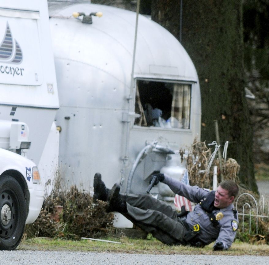 German Township Patrolman Jeremy Blum is wounded in a police shootout with a gunman at Enon Beach trailer park near Springfield, Ohio, on Saturday, Jan. 1, 2011. Patrolman Blum was shot in the arm and shoulder and taken to Miami Valley Hospital in Dayton, where he is in stable condition, according to German Township Police Chief William Dickerson, as reported by the Springfield News-Sun. (AP Photo/Springfield News-Sun, Marshall Gorby)