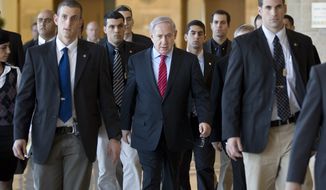 Israeli Prime Minister Benjamin Netanyahu (center), surrounded by bodyguards, arrives at a Foreign Affairs and Security Committee meeting in the Knesset, Israel&#39;s parliament, in Jerusalem on Monday, Jan. 3, 2011. (AP Photos/Bernat Armangue)