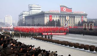 Tens of thousands of North Koreans attend a New Year&#39;s rally to display loyalty to leader Kim Jong-il in the central Kim Il-sung Square in Pyongyang, North Korea, on Monday, Jan. 3, 2011. (AP Photo/APTN)