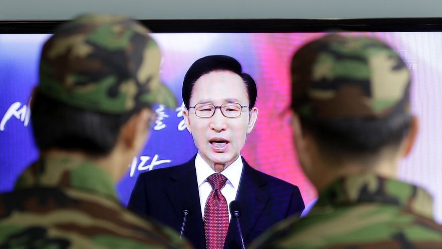 South Korean soldiers at the main train station in Seoul watch a live TV broadcast of South Korean President Lee Myung-bak's New Year's speech to the nation on Monday, Jan. 3, 2011. Mr. Lee said his country has no choice but to aggressively boost its defenses after a deadly North Korean artillery attack, vowing not to let the North "covet even an inch of our territory." (AP Photo/Lee Jin-man)