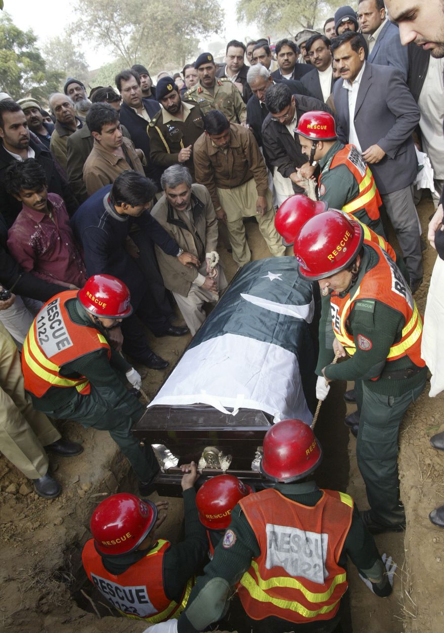 Pakistanis bury Punjab Gov. Salman Taseer, who enraged Muslims by opposing laws that decreed death for insulting Islam and was slain by a bodyguard. (Associated Press)