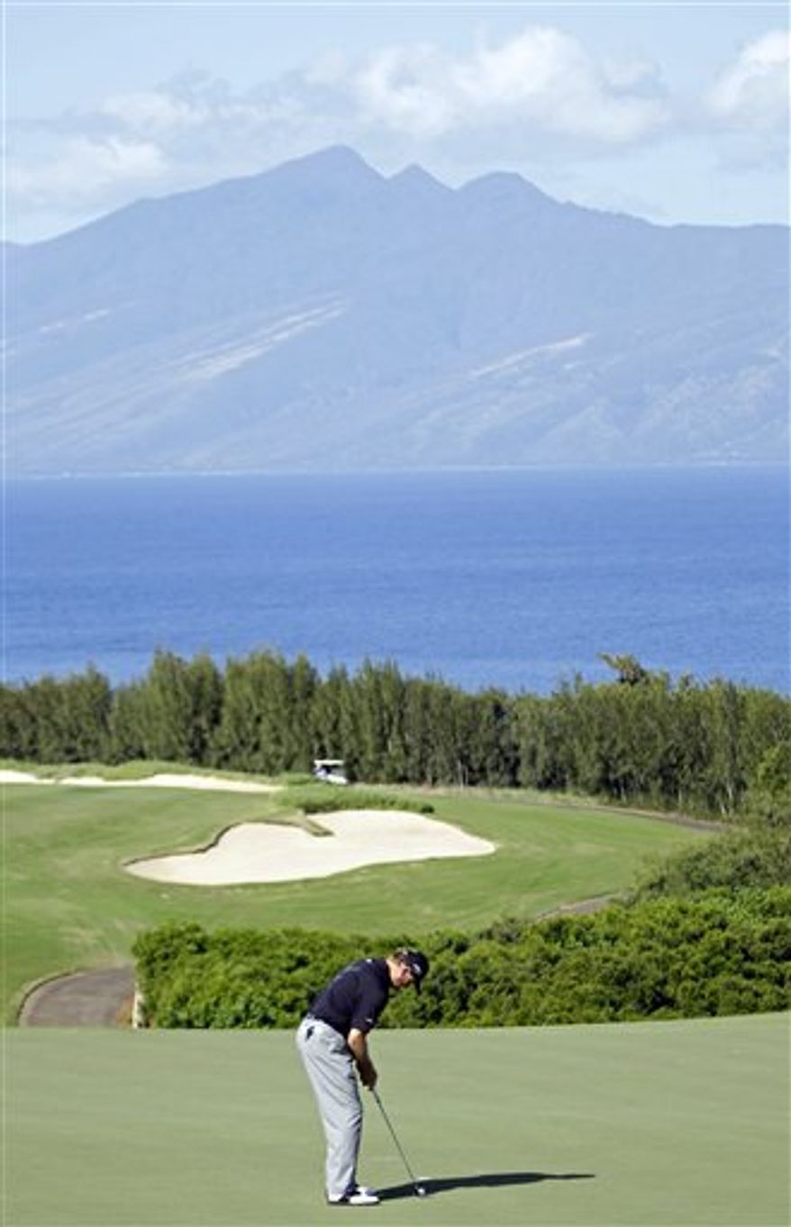 Jonathan Byrd waves on the 18th green during the final round of the Hyundai Tournament of Champions golf tournament in Kapalua, Hawaii on  Sunday, Jan. 9, 2011. Byrd won the tournament on the second playoff hole against Robert Garrigus. (AP Photo/Eric Risberg)