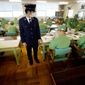 A guard at Onomichi Prison in Onomichi, Japan, near Hiroshima, watches elderly inmates work during their six-hour labor shift. Japan&#39;s population is aging faster than any other nation&#39;s, and that means increased numbers of elderly prisoners. (Associated Press)