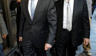 Anna Nicole Smith&#x27;s longtime companion, Howard K. Stern (left), and his attorney, Steve Sadow, leave Los Angeles Superior Court on Thursday, after a judge voided his conviction. (Associated Press)