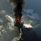 The Deepwater Horizon oil rig burns in April after exploding in the Gulf. A federal panel has concluded that decisions made to save time and money increased danger. (Associated Press)