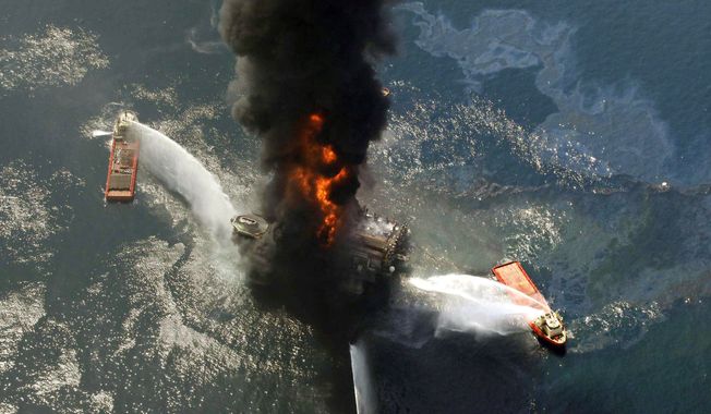 The Deepwater Horizon oil rig burns in April after exploding in the Gulf. A federal panel has concluded that decisions made to save time and money increased danger. (Associated Press)