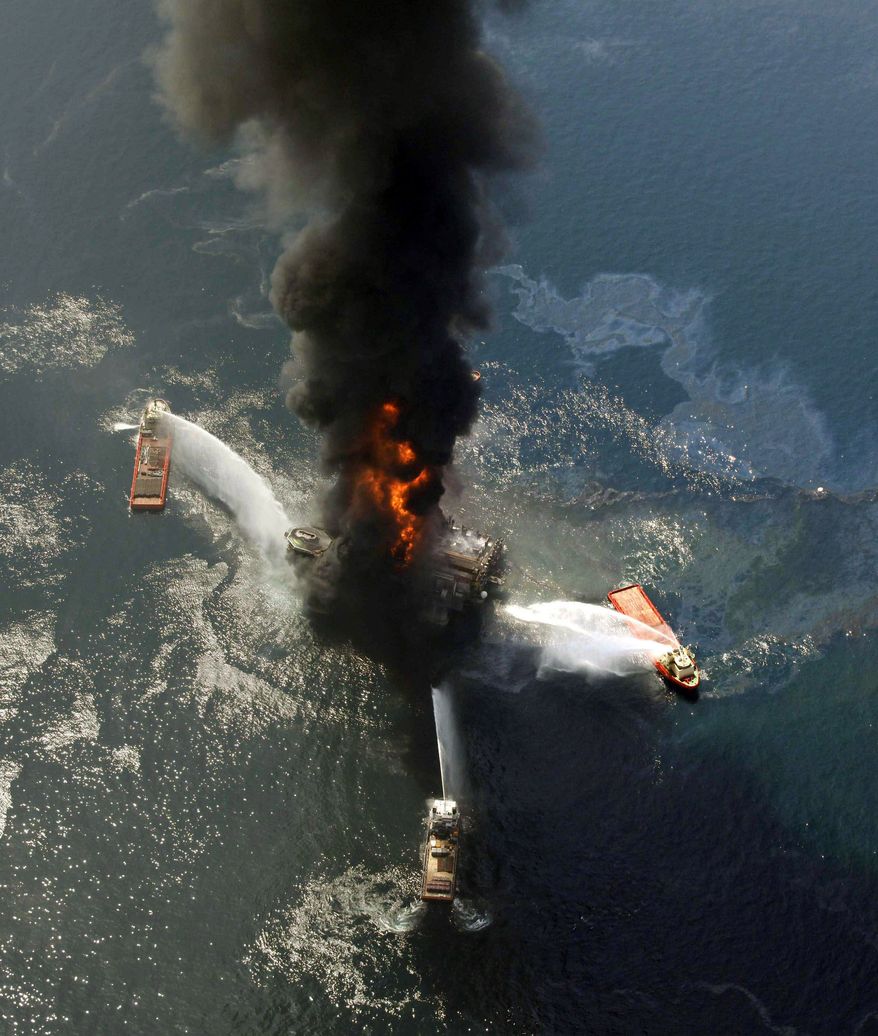 The Deepwater Horizon oil rig burns in April after exploding in the Gulf. A federal panel has concluded that decisions made to save time and money increased danger. (Associated Press)
