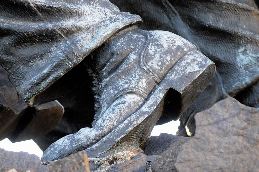 A Marine's boots on the ground show chipping paint. (Rod Lamkey Jr./Special to The Washington Times)