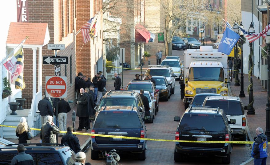 Frances Street in Annapolis, Md., is blocked off as officials probe a suspicious package at a state office building Thursday. A similar package was sent to Hanover, Md. (Associated Press)