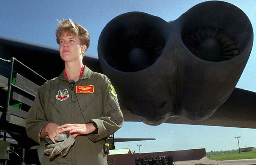 Lt. Kelly Flinn, the nation's first female bomber pilot, stands near the wing of a B-52 at Barksdale Air Force Base in Bossier, La., April 21, 1995. (Photo: Associated Press)
