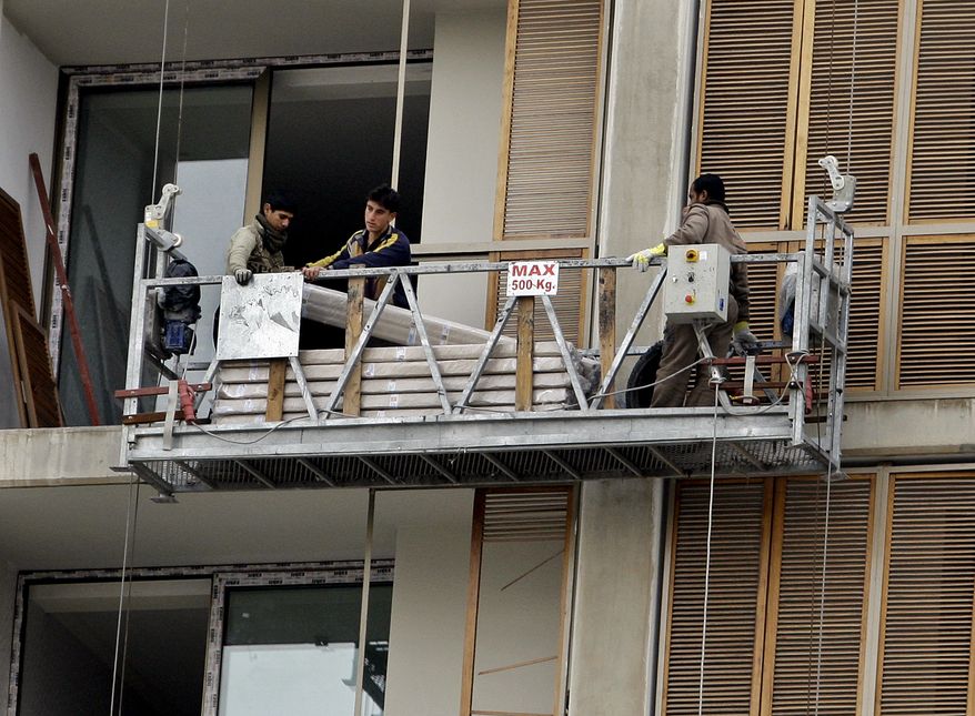 Workers make repairs to the Sheraton Hotel in central Baghdad on Sunday, Jan. 9, 2011. Insurgent threats and a lack of space in hotels being rebuilt from bombings have cast doubt on whether the Arab League can hold its annual meeting in Iraq this spring. Iraqi and league officials maintain the March 23 summit will take place as planned. (AP Photo/Hadi Mizban)
