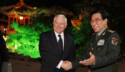 U.S. Secretary of Defense Robert M. Gates (left) and Gen. Xu Caihou, vice chairman of China&#39;s Central Military Commission, meet at the Diaoyutai Guest House in Beijing on Monday, Jan. 10, 2011. (AP Photo/Larry Downing, Pool)