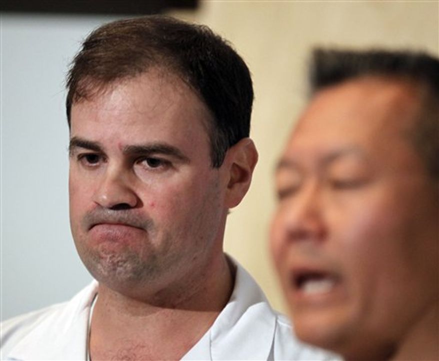 Dr. G. Michael Lemole, Jr., left, speaks about the condition of U.S. Rep. Gabrielle Giffords, D-Ariz., as Dr. Peter Rhee looks on at University Medical Center during a news conference in Tucson, Ariz., Sunday, Jan. 9, 2011. Giffords was shot in the head the Saturday during a speech at a local supermarket. (AP Photo/Chris Carlson)
