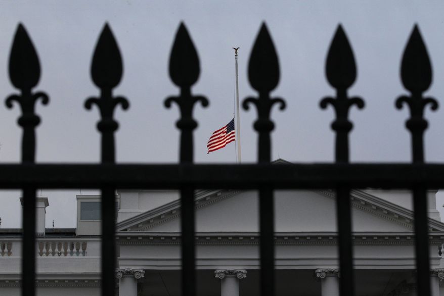 As ordered by President Obama, the American flag flies at half-staff over the White House at dawn, in Washington, Monday. Jan. 10, 2011, in observance of Rep. Gabrielle Giffords, Arizona Democrat, and the other victims of an assassination attempt against her in Saturday's shooting outside a Tucson, Ariz., supermarket. (AP Photo/J. Scott Applewhite)