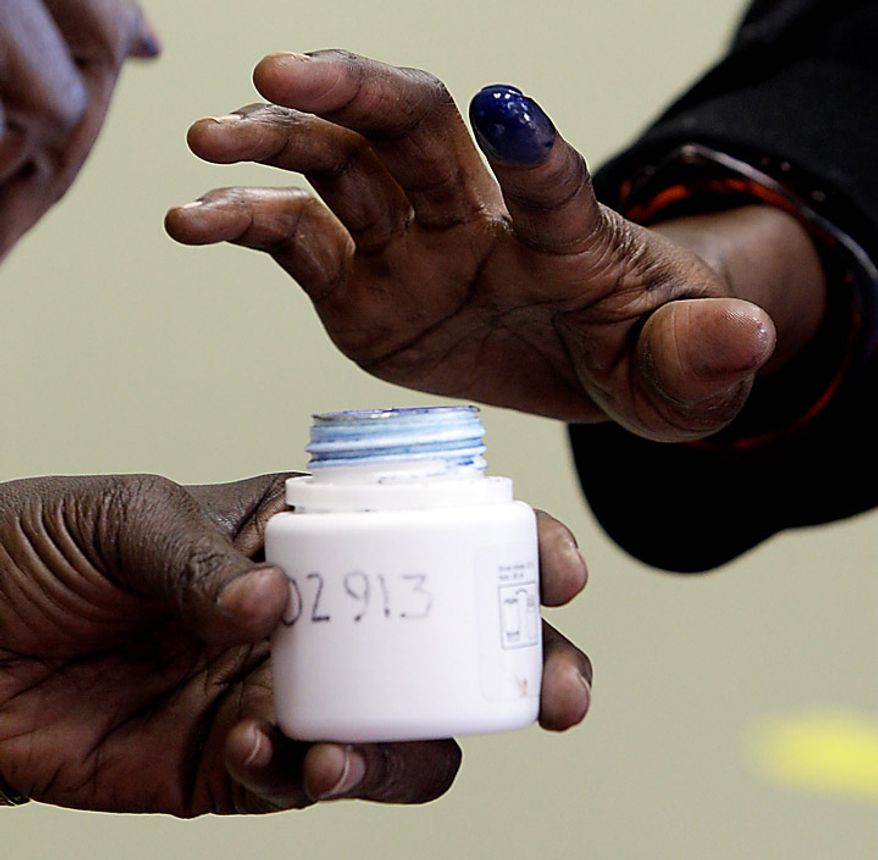 Nyandeng Thongjang inks her finger after casting her vote at a polling center in Chicago on Sunday, Jan. 9, 2011. Southern Sudanese living in the United States traveled to eight polling sites from Phoenix to Boston to cast their votes. This morning marks the first opportunity for Southerners to cast ballots in an independence referendum, the outcome of which will determine if the South secedes from the North to form an independent country. (AP Photo/Nam Y. Huh)