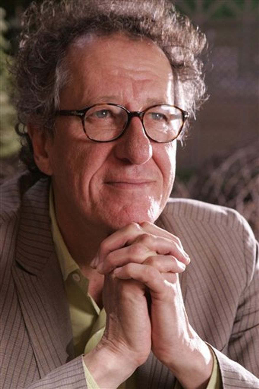 FILE - In this Sept. 14, 2009 file photo, actor Geoffrey Rush poses for a portrait at the 34th Toronto International Film Festival in Toronto. (AP Photo/Carlo Allegri, file)