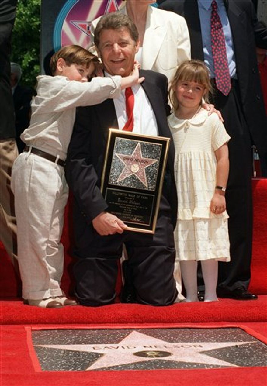 FILE - This undated file photo shows the Nelson Family, Ozzie and Harriet with sons Ricky, left, and David, in their television home. David Nelson, who starred on his parents' popular television show "The Adventures of Ozzie and Harriet,"  died Monday, Jan. 10, 2011, at his home in the Century City area of Los Angeles He was 74. (AP Photo/A&E, File) NO SALES