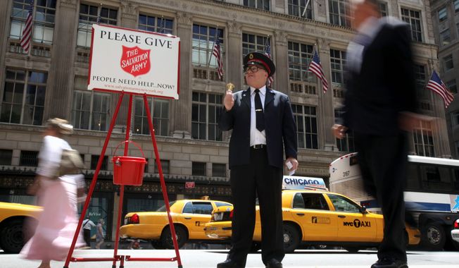 Salvation Army &quot;soldier&quot; Daniel Aherns collects donations on Fifth Avenue at Rockefeller Center in New York in 2011. (Associated Press)