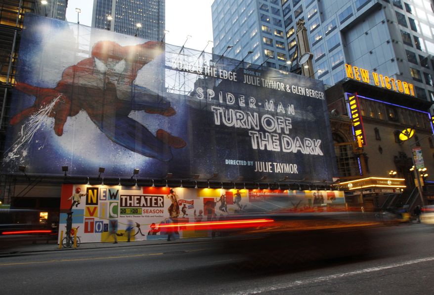 FILE - An Oct. 5, 2010, file photo shows a banner covering the front of the Foxwoods Theater on 42nd street in New York for the play "Spider-Man: Turn off the Dark." (AP Photo/Kathy Willens/file)