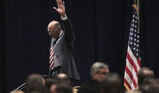 Republican National Committee (RNC) Chairman Michael Steele walks off stage after announcing that he would drop his re-election bid, Friday, Jan. 14, 2011, during the Republican National Committee Winter Meeting in Oxon Hill, Md. (AP Photo/Pablo Martinez Monsivais)