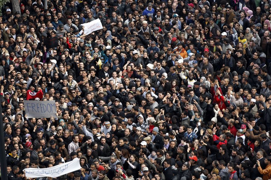 Protesters chant slogans against President Zine El Abidine Ben Aliin during a demonstration in Tunis, Friday, Jan. 14, 2011. (AP Photo/Christophe Ena)
