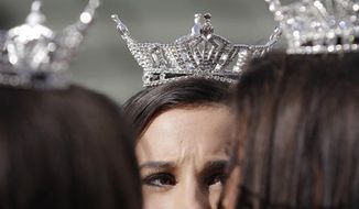 ** FILE ** Miss America contestants wait for the start of the &quot;Show Us Your Shoes&quot; parade on Friday, Jan. 14, 2011, in Las Vegas. (AP Photo/Julie Jacobson)