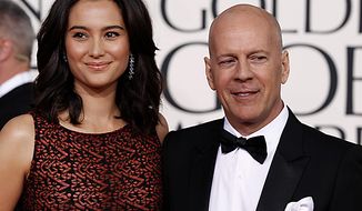 ** FILE ** Bruce Willis arrives with his wife Emma Heming for the Golden Globe Awards Sunday, Jan. 16, 2011, in Beverly Hills, Calif. (AP Photo/Matt Sayles)