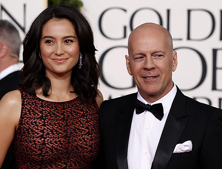 ** FILE ** Bruce Willis arrives with his wife Emma Heming for the Golden Globe Awards Sunday, Jan. 16, 2011, in Beverly Hills, Calif. (AP Photo/Matt Sayles)