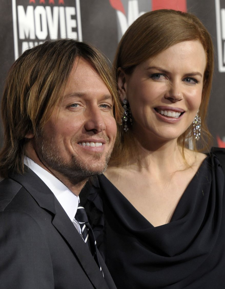 ** FILE ** In this Jan. 14, 2011, file photo, Nicole Kidman, right, and Keith Urban arrive at the 16th Annual Critics' Choice Movie Awards in Los Angeles. The couple on Monday, Jan. 17, announced the arrival of their second daughter, Faith Margaret Kidman Urban, born on Dec. 28 at a Nashville, Tenn., hospital. (AP Photo/Dan Steinberg, File)
