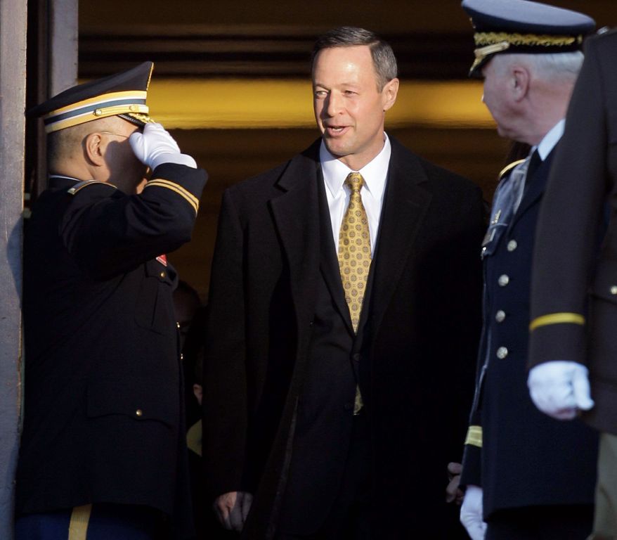 Maryland Gov. Martin O'Malley is saluted before attending inauguration ceremonies outside the Maryland State House in Annapolis, Md, on Wednesday. Mr. O'Malley was sworn in for a second term in office. He focused on economic matters during an 11-minute inauguration speech. (Associated Press)