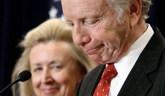 U.S. Sen. Joe Lieberman, Connecticut independent, accompanied by his wife, Hadassah, addresses a gathering Wednesday in Stamford, Conn. He has announced that he will not seek a fifth term in 2012. (Associated Press)