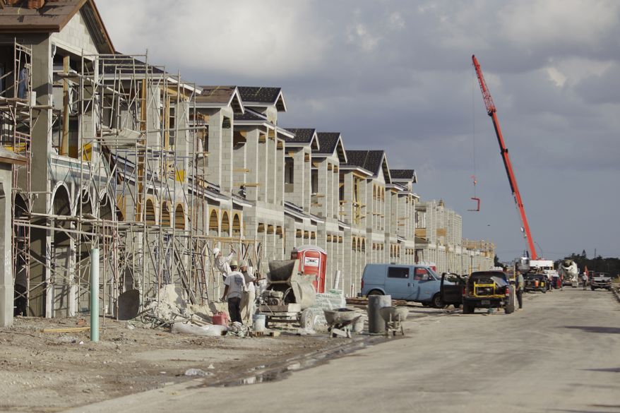 Construction of new homes continues in the Vista Del Sol section of the planned community of Monterra, in Cooper City, Fla. Tuesday, Jan 18, 2011. Builders began work last year on the second fewest number of homes in more than half a century, as the weak economy kept people from buying houses.(AP Photo/J Pat Carter)