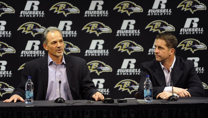 Baltimore Ravens head coach John Harbaugh, right, and new defensive coordinator Chuck Pagano speak during a news conference in Owings Mills, Md., Wednesday, Jan. 19, 2011. (AP Photo/Gail Burton)
