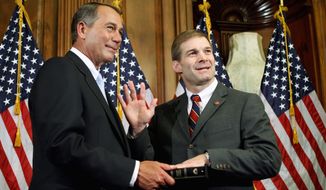 ** FILE ** This file photo shows House Speaker John Boehner, Ohio Republican, (left) and Rep. Jim Jordan, Ohio Republican. &quot;Families and businesses have had to cut back, and they&#39;re demanding that Washington do the same,&quot; said Jordan, chairman of the Republican Study Committee, the House conservative caucus. (Associated Press)
