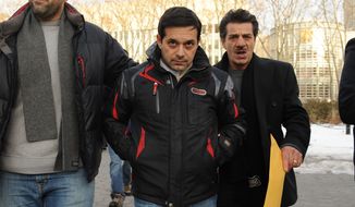 Angelo Spata (center) leaves Brooklyn federal court after posting bail Thursday in New York. Mr. Spata, accused of being an associate of the Colombo crime family, was arrested Thursday in one of the biggest Mafia takedowns in FBI history. (Associated Press)