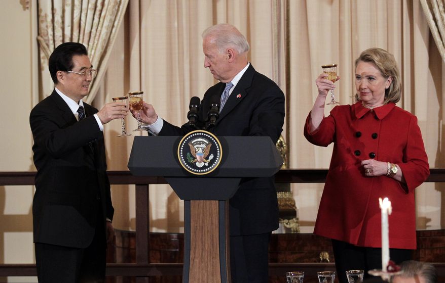 Chinese President Hu Jintao shares a toast with Vice President Joseph R. Biden Jr. and Secretary of State Hillary Rodham Clinton during a luncheon in Mr. Hu&#39;s honor at the State Department on Wednesday. (Associated Press)