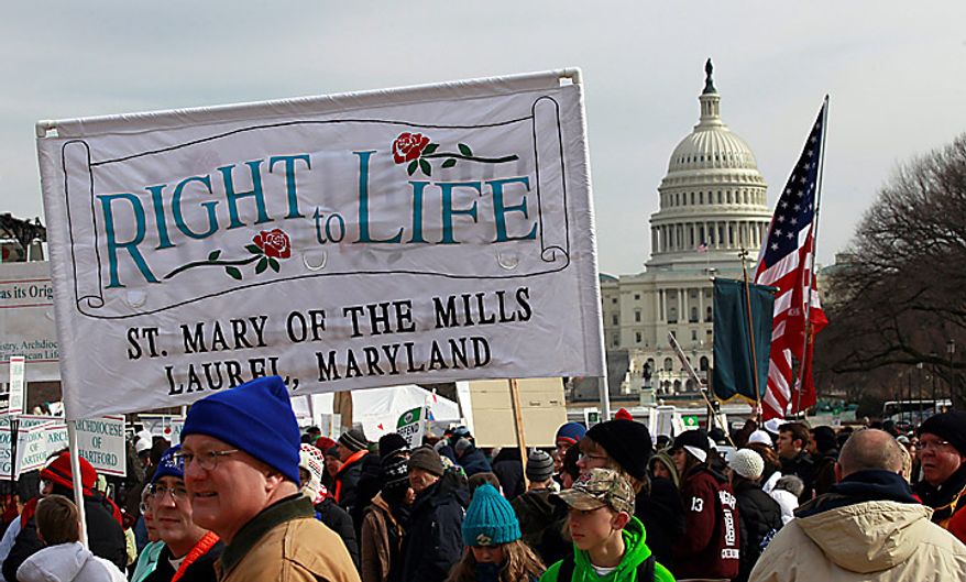 The crowd gathers at the start of an anti-abortion rally on the National Mall in Washington on Monday, Jan. 24, 2011. The anniversary of the Supreme Court's Roe v. Wade decision was Saturday. (AP Photo/Alex Brandon)