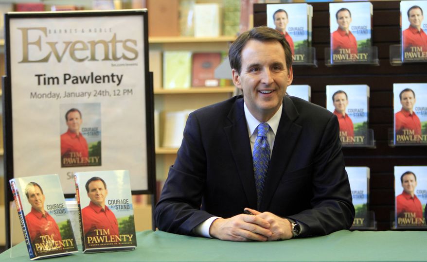 Former Minnesota Gov. Tim Pawlenty, a Republican, gets ready to sign copies of his new book, "Courage to Stand: An American Story," on Monday, Jan. 24, 2011, in Manchester, N.H. (AP Photo/Jim Cole)