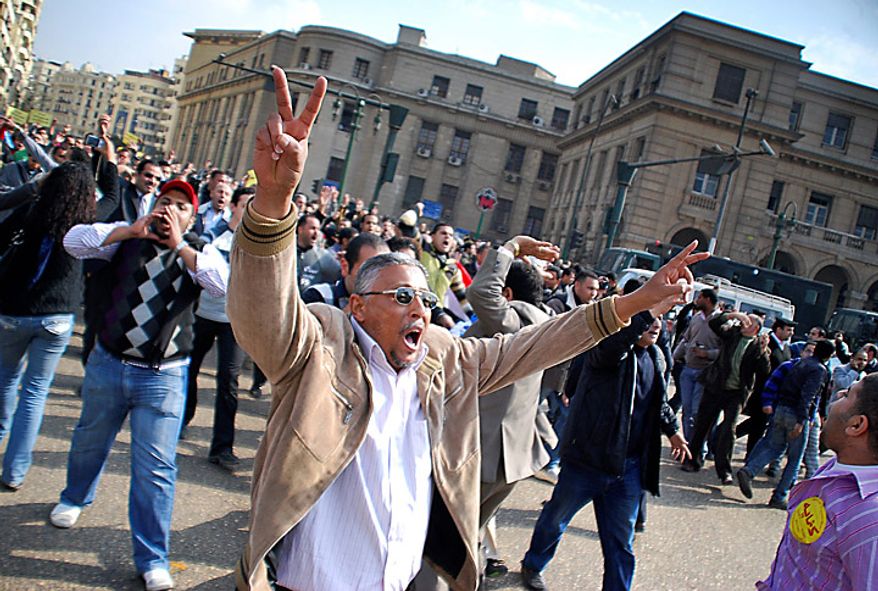 Anti-government protesters demonstrate in downtown Cairo, Egypt, Tuesday, Jan. 25, 2011. Hundreds of anti-government protesters marched in the Egyptian capital chanting against President Hosni Mubarak and calling for an end to poverty. (AP Photo/Mohammed Abu Zaid)