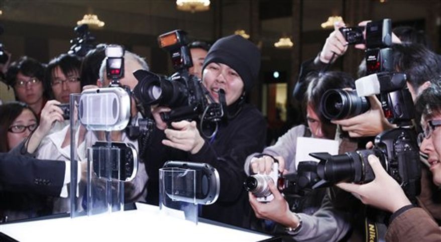 The new PlayStation Portable "NGP" is displayed at PlayStation Meeting 2011 in Tokyo Thursday, Jan. 27, 2011. Sony says an upgraded version of its PlayStation Portable machine will go on sale late this year. (AP Photo/Shizuo Kambayashi)