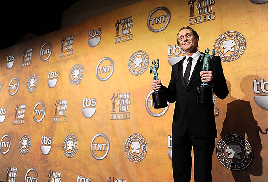 Steve Buscemi poses with the best male actor in a drama series and best ensemble in a drama series trophies for his work on "Boardwalk Empire" at the 17th Annual Screen Actors Guild Awards on Sunday, Jan. 30, 2011, in Los Angeles. (AP Photo/Vince Bucci)