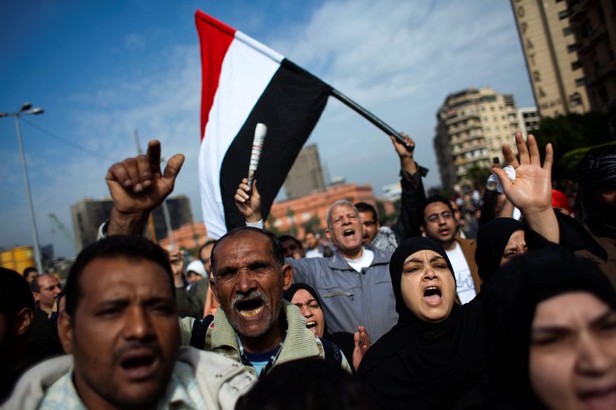 Anti-government protesters shout their demands Tuesday as they march toward Tahrir Square in Cairo. Egyptian authorities have sought to save President Hosni Mubarak's regime with a series of concessions and promises to protesters, but the democratic fervor in the streets may prevail. Mr. Mubarak has announced he will not run for re-election in September. (Associated Press)