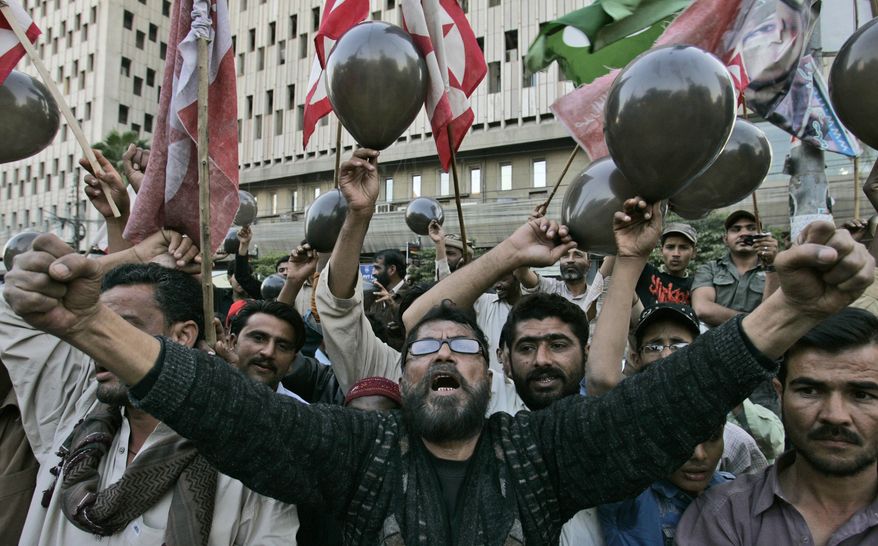 Supporters of a Pakistani socio-political group, Pasban, protest against a U.S. consular employee suspected in the shooting deaths of two Pakistani men in Lahore on Thursday, in Karachi, Pakistan, Tuesday, Feb. 1, 2011. A Pakistani court ordered the government Tuesday not to release the American official despite U. S. insistence that he has diplomatic immunity and has been detained illegally. (AP Photo/Shakil Adil)