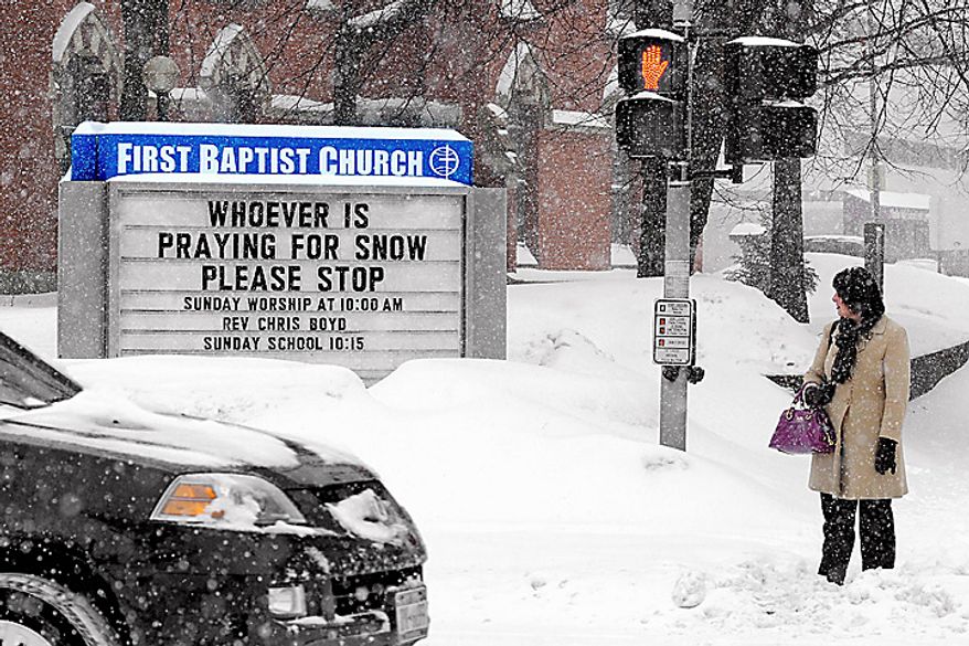 Rebecca Valk walks to her office in Poughkeepsie, N.Y., in near-whiteout conditions on Tuesday, Feb. 1, 2011. A monster storm began to bear down on the middle of the nation, threatening to leave up to a third of the nation covered in brutal winter weather. (AP Photo/Poughkeepsie Journal, Spencer Ainsley)